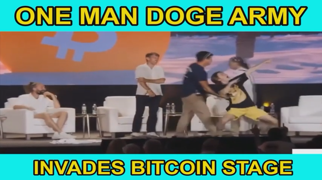 One Man DOGE Army Storms Bitcoin Stage, Rips Suit & Does This One Thing That Leaves Everyone Stupefied