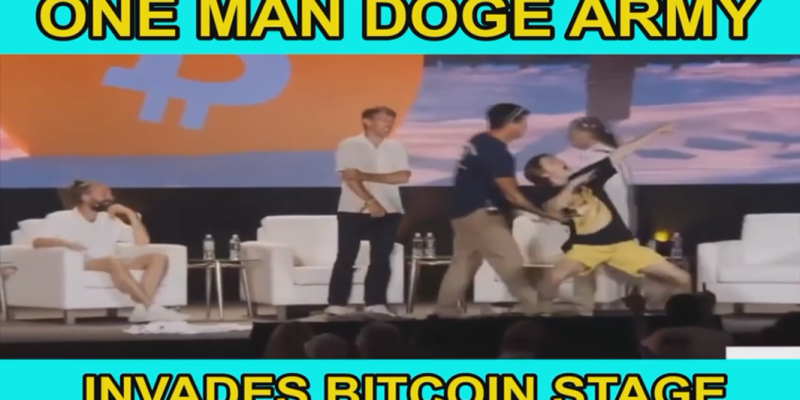 One Man DOGE Army Storms Bitcoin Stage, Rips Suit & Does This One Thing That Leaves Everyone Stupefied